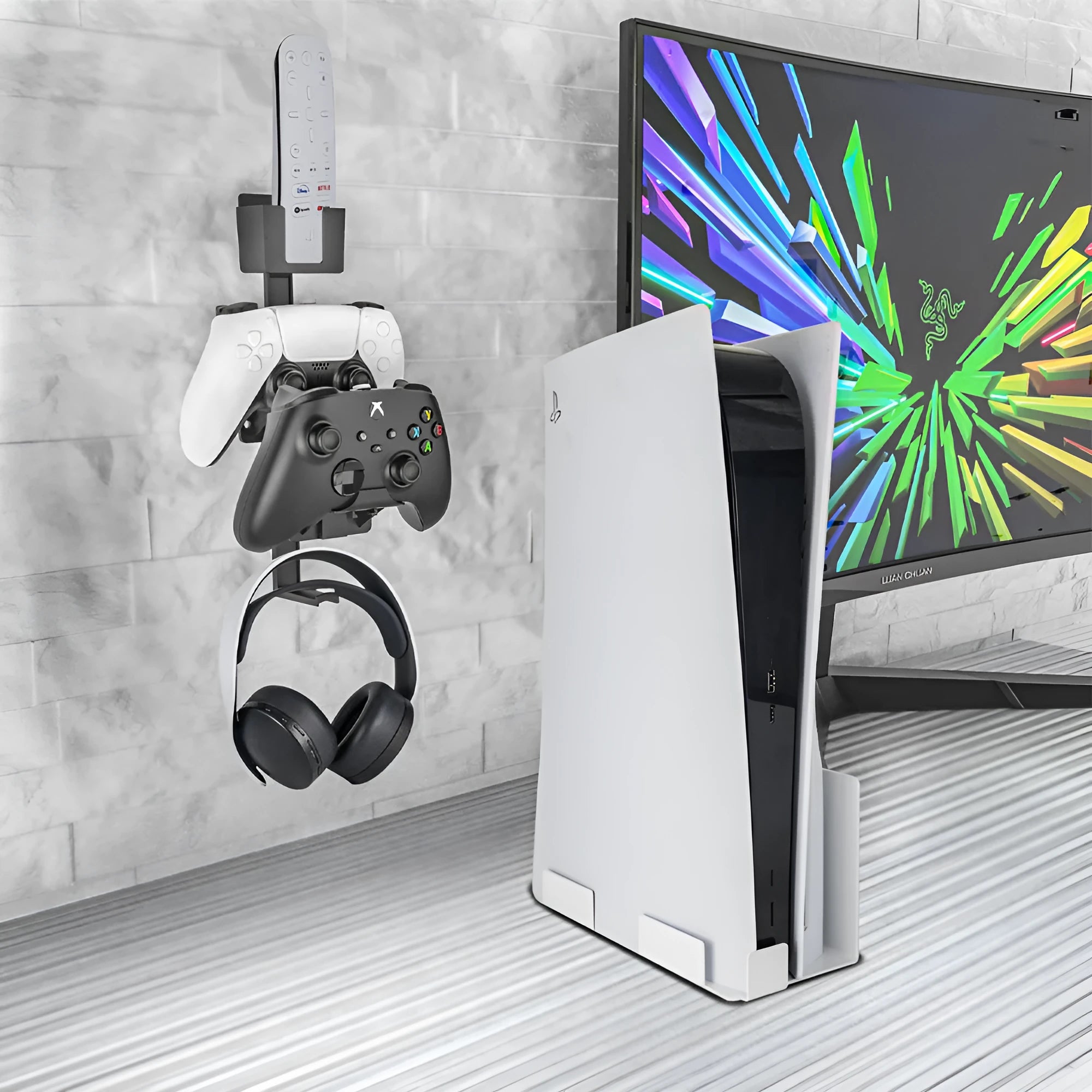 Wall-mounted white ABS plastic hook holding PS5 controller and gaming headset