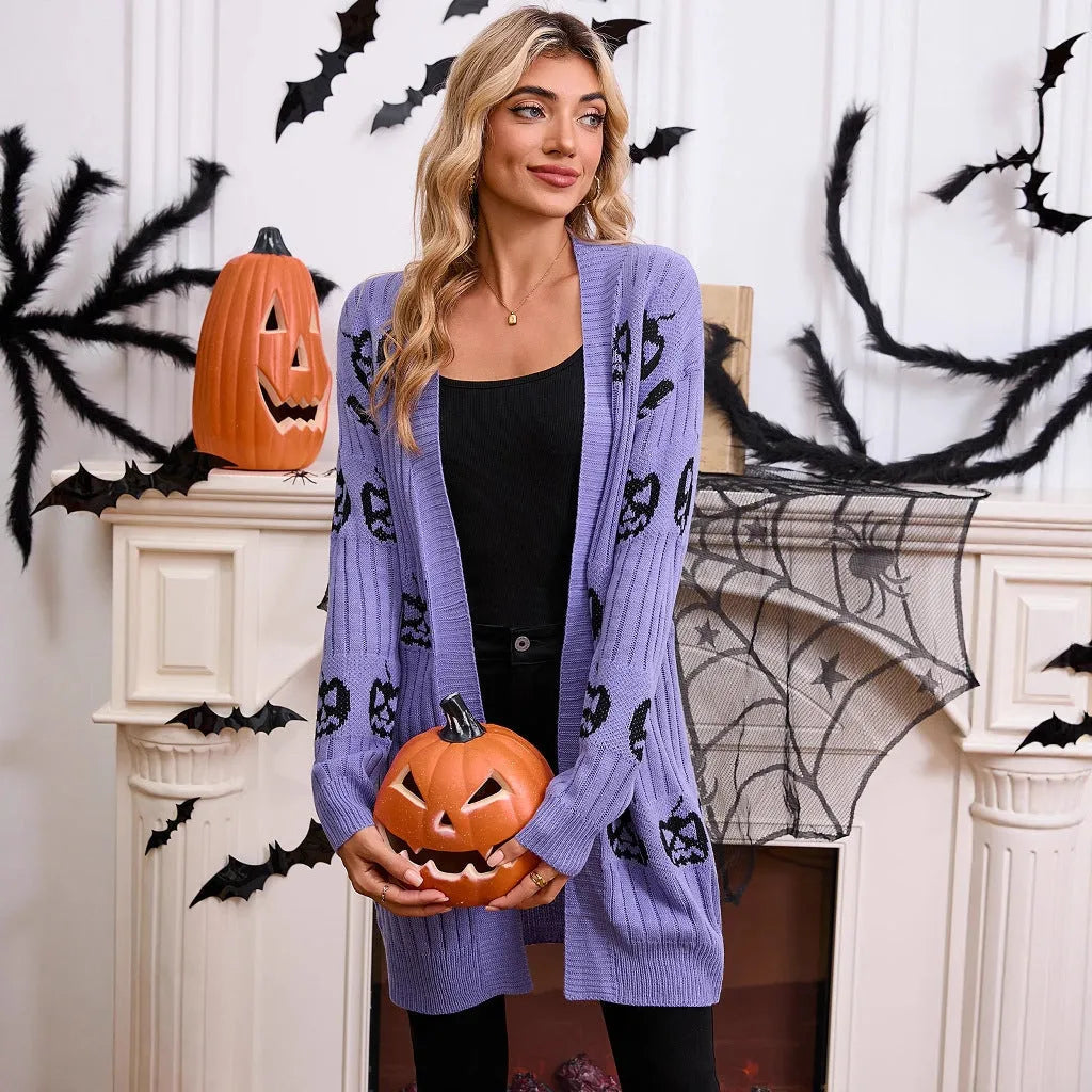 Women's black Halloween cardigan with orange Jacquard knitted pumpkin head pattern, shown as an open medium-length knit.