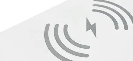 White 3-in-1 LED night light with wireless charging pad and alarm clock display
