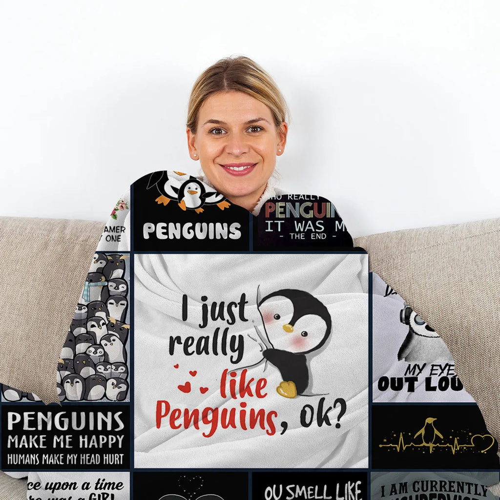 Multicolored flannel velvet blanket with penguin patterns, 130x150cm, on a sofa