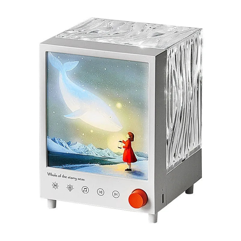 Aurora Treasure Box Star Sea Whale projection lamp with Bluetooth on a table.