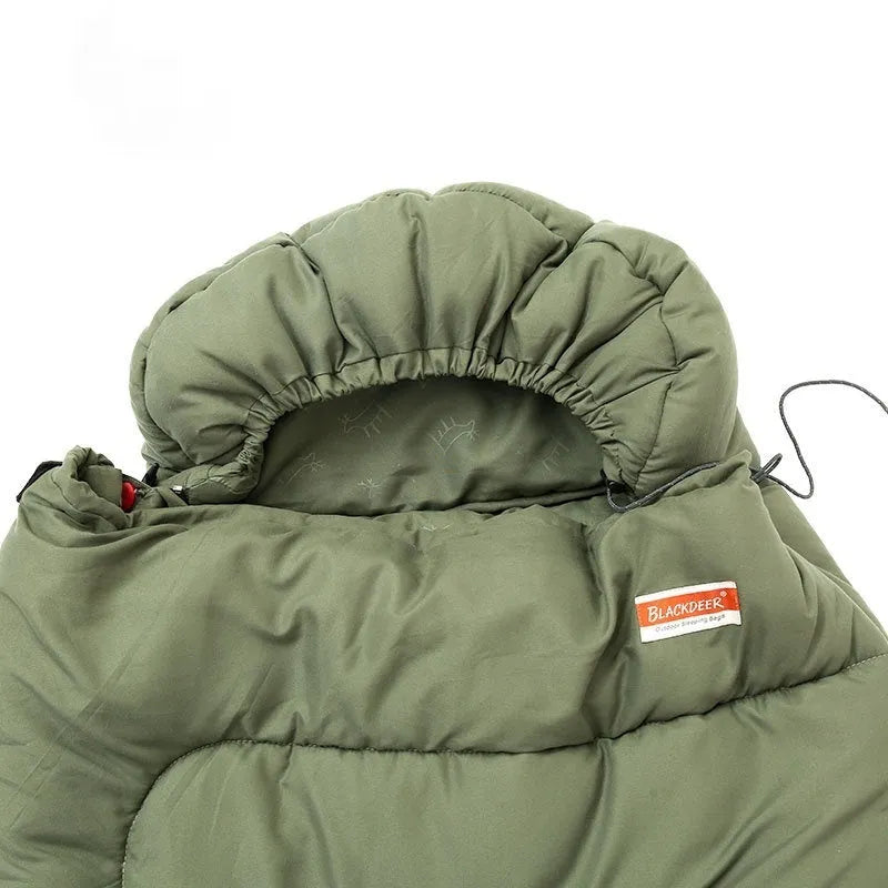 Ochre and olive green cotton sleeping bag quilt laid out flat, showing its quilted texture and portable size.