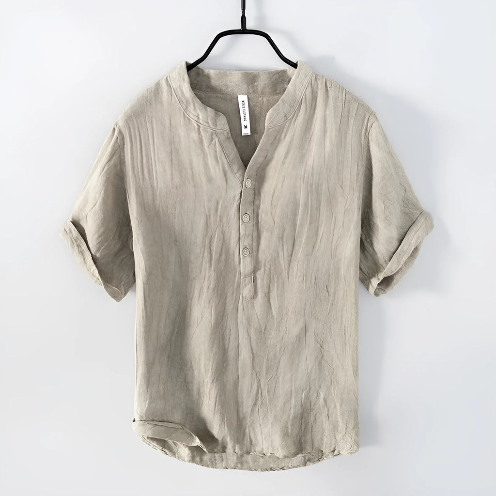 Retro-style solid colour linen pullover top with short sleeves and a striped pattern.