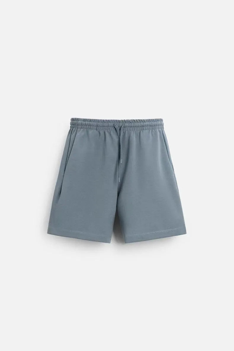 Loose-fit textured polyester short sleeve shirt and matching shorts set on a hanger, shown in a blue colour combination.