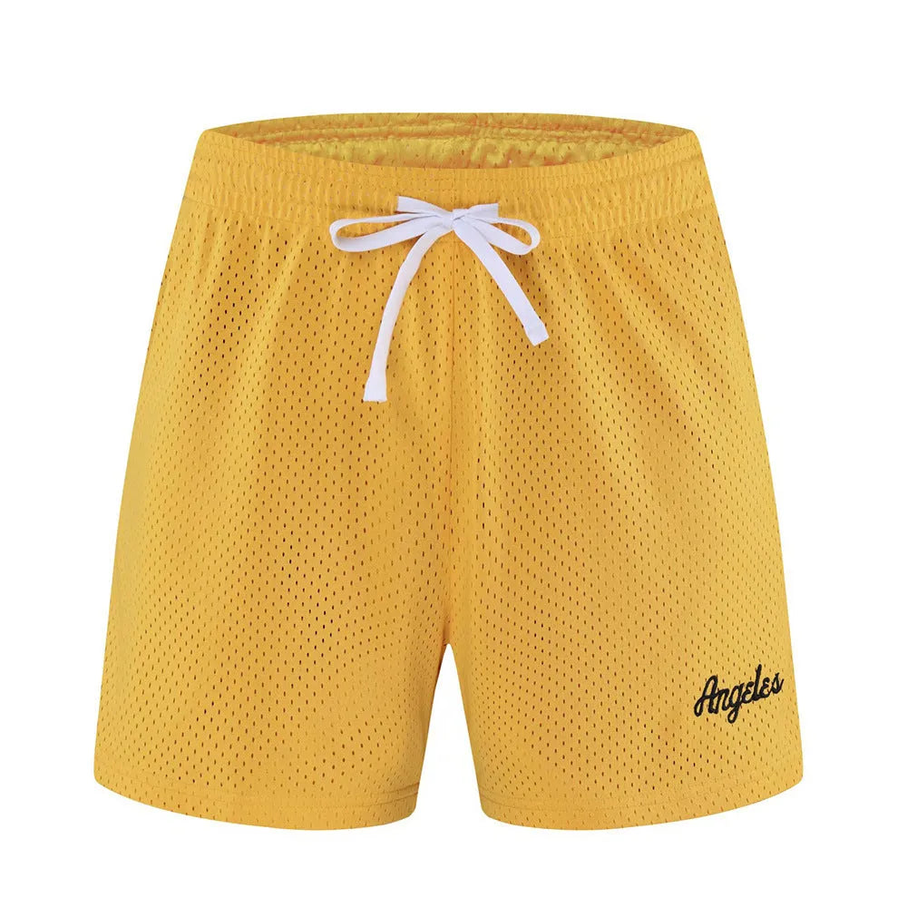 Men's black double-layer mesh sports shorts on a hanger with colour swatches showing white, yellow, green, and purple options.