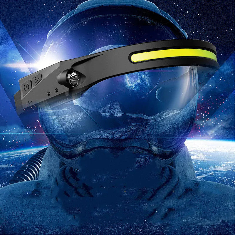 Black silicone rechargeable headlamp with LED lights, shown with wide beam and long-range illumination for outdoor use.