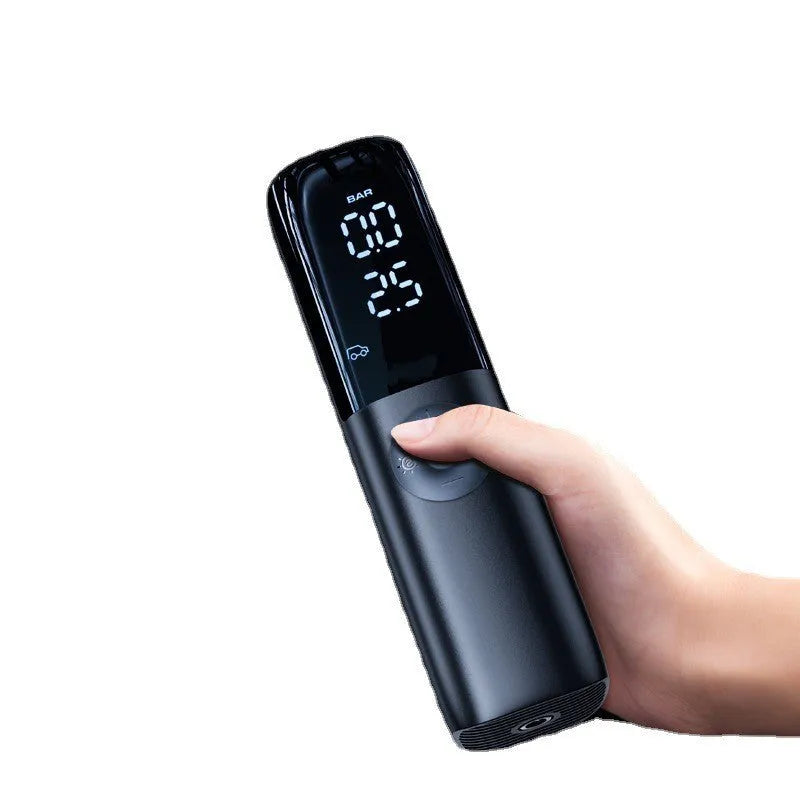 Black portable electric car air pump with tyre pressure gauge and plug connection
