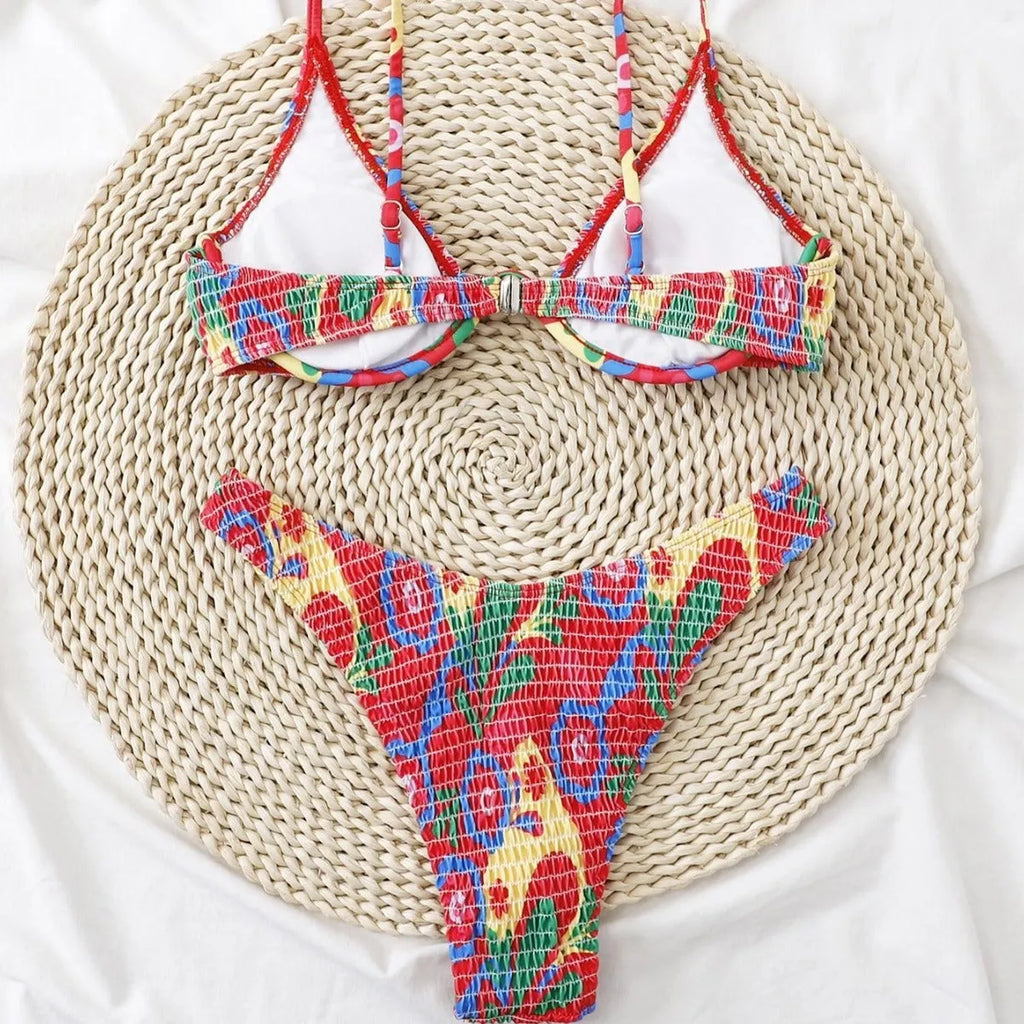 Red floral underwire bikini top and briefs on a white background.