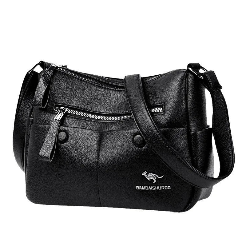 Soft square black PU leather women's crossbody shoulder bag showing front view and open interior with multiple pockets.