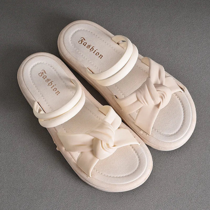 Women's black and white PVC sandals with a soft back, two-way strap design, and a non-slip sole.