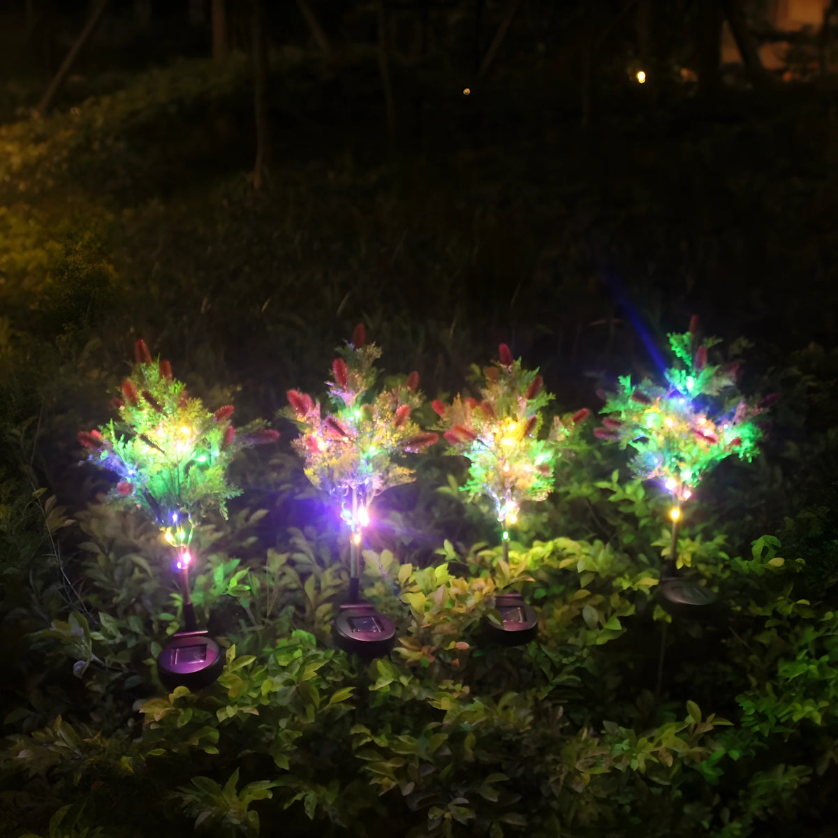LED solar Christmas tree ground lamp with 15-color LED, 70cm tall, plastic and stainless steel construction, purple or red options