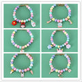 Macaron-coloured resin pet collar with moon charm and matching adjustable bracelet for cats or small dogs.