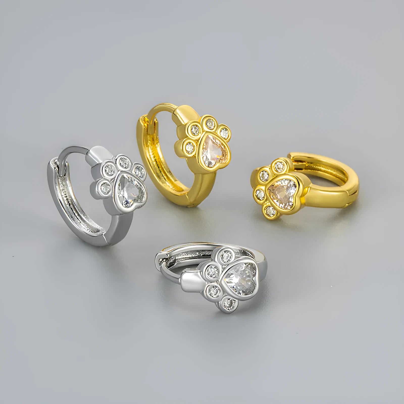 Cat paw zircon ear studs in gold and white gold copper finish