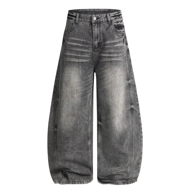 Men's loose straight washed denim jeans in black, front view showing zip fly and straight leg cut.