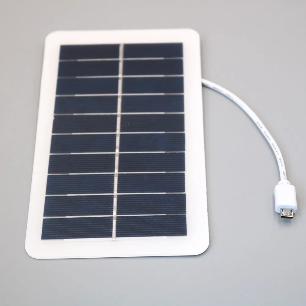 Black solar phone charging panel with USB port showing PET textured surface