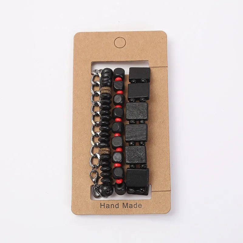 Set of four handmade retro woven alloy bracelets in different colours on a neutral background