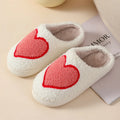 Women's cartoon love style plush slippers in blue smiley colour with round toe and non-slip sole.