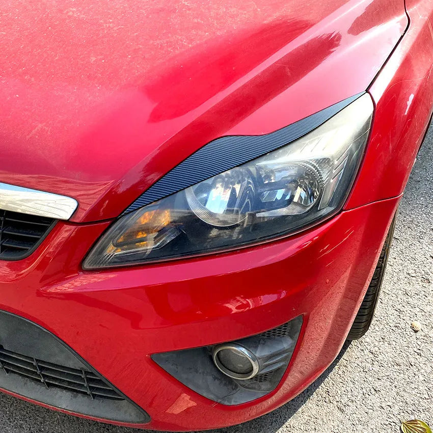 Ford Focus headlight eyebrow stickers in carbon fibre pattern and piano black ABS plastic