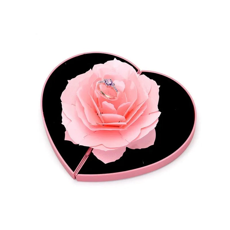 Red rotating ring box with 3D heart-shaped rose decoration for jewellery display