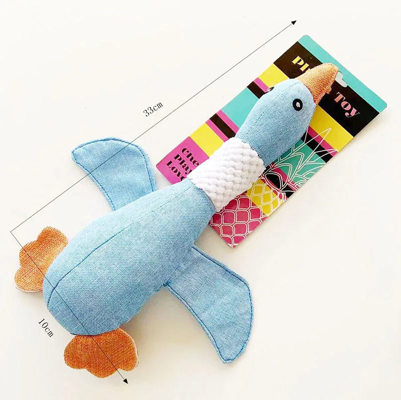 Blue duck-shaped plush dog toy with squeakers for chewing and interactive play