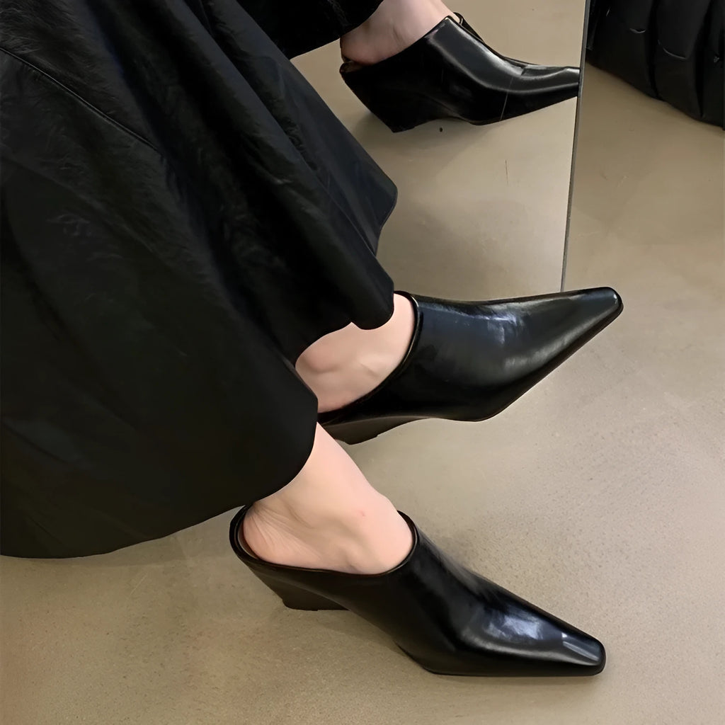 Women's black wind wedge closed toe half slippers made of PU material.