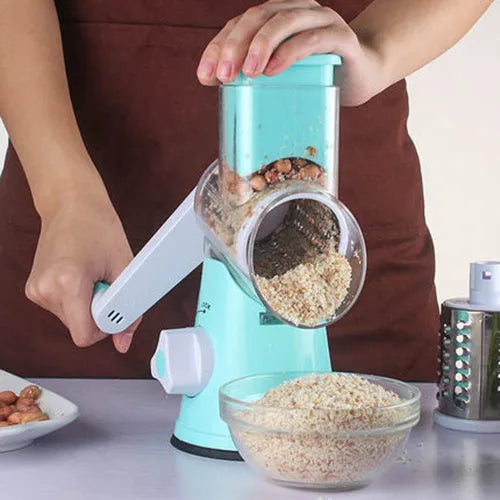 Blue round manual mandoline kitchen slicer with stainless steel blade on a countertop.
