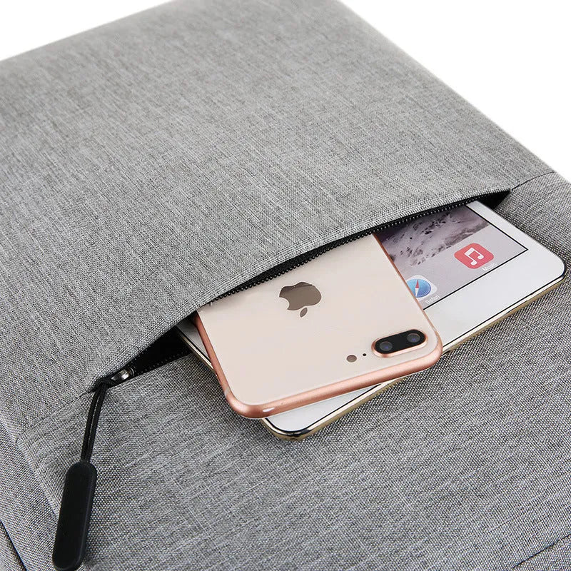 Large black sports backpack with curved shoulder straps showing USB charging port and 20-35 litre capacity