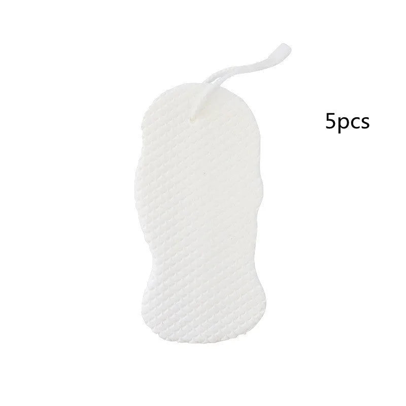 White 3D bath sponge with fish scale pattern for gentle body exfoliation in shower.