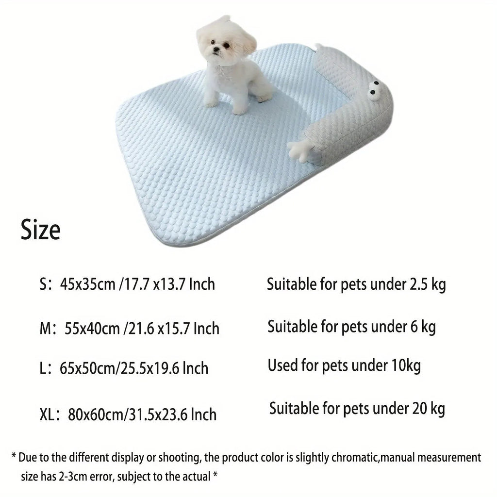 Blue pet cooling pad with big-eyed monster design, shown on a wooden floor.