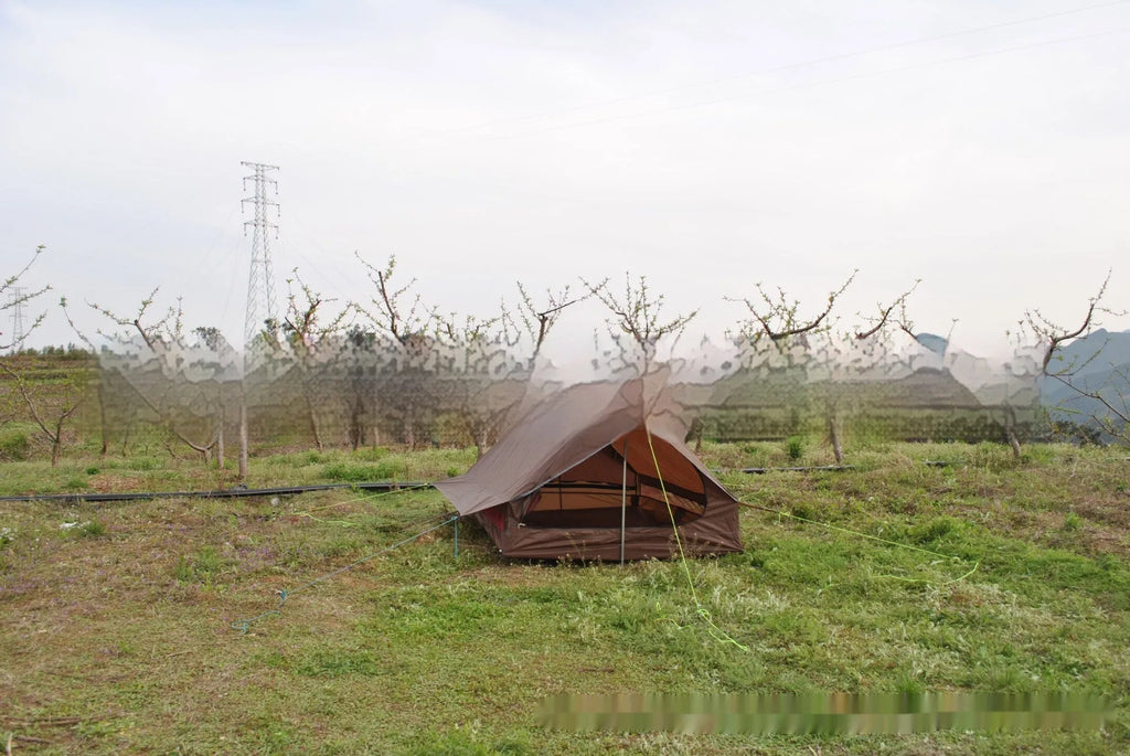 Brown A-line pole-free tent erected with hiking canes showing 2-3 person capacity and waterproof fabric construction