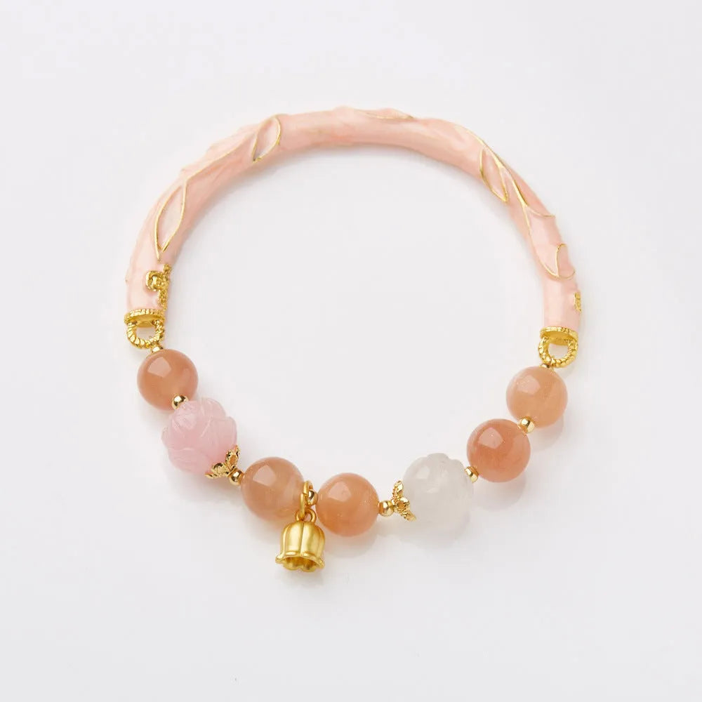 Chinese style sunstone jade bracelet with lily pattern and geometric gold thread design