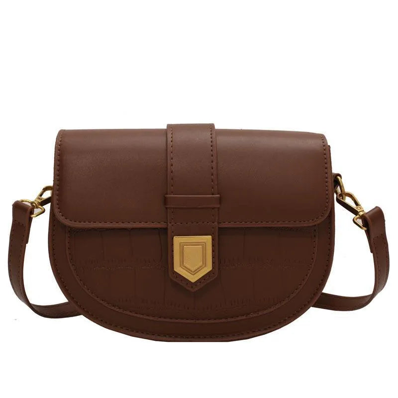 French one shoulder saddle bag for women with lock and stone pattern, available in beige