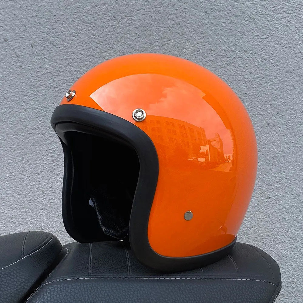 A retro-styled half motorcycle helmet made from glass fibre, shown in a matte black flower colour finish.