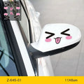 A pair of reflective cartoon eye car stickers on a vehicle rearview mirror.