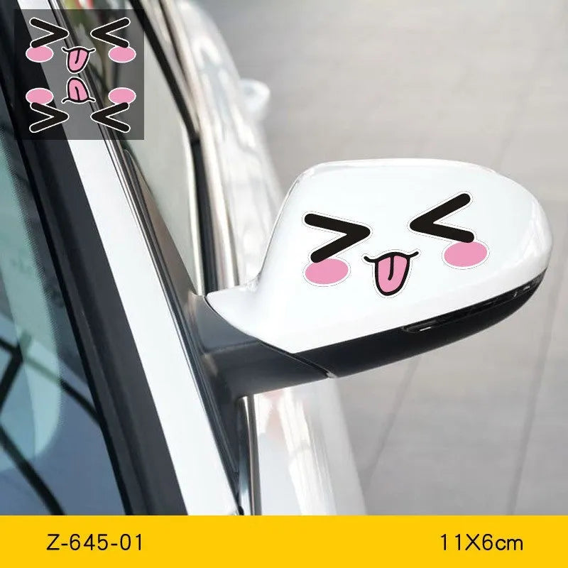 A pair of reflective cartoon eye car stickers on a vehicle rearview mirror.