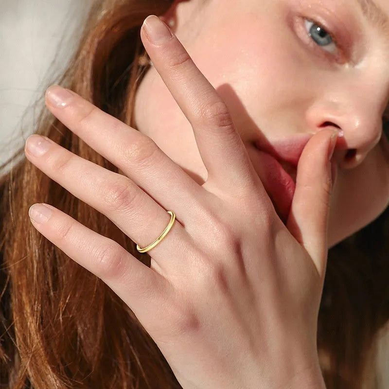 Simple geometric S925 sterling silver bracelet ring shown on a finger, with k gold and k platinum plated version options.