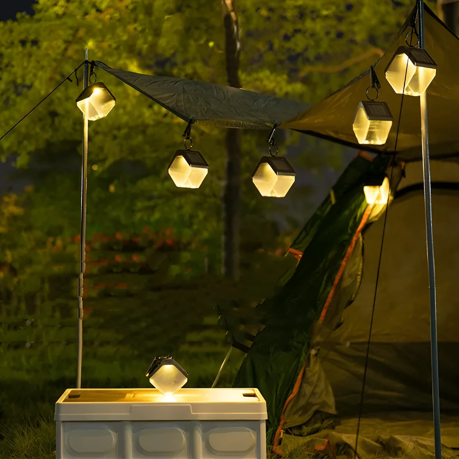 Outdoor solar ice brick chandelier with dual colour LED warm and colour light hanging in a garden