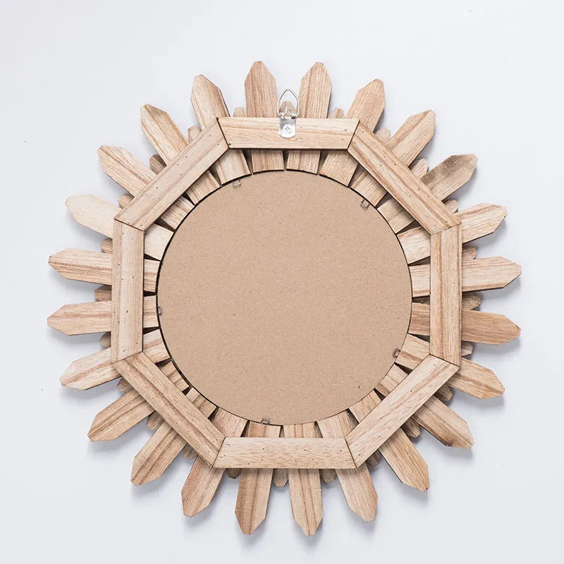 European style solid wood round hanging mirror in baked colour finish on a wall.