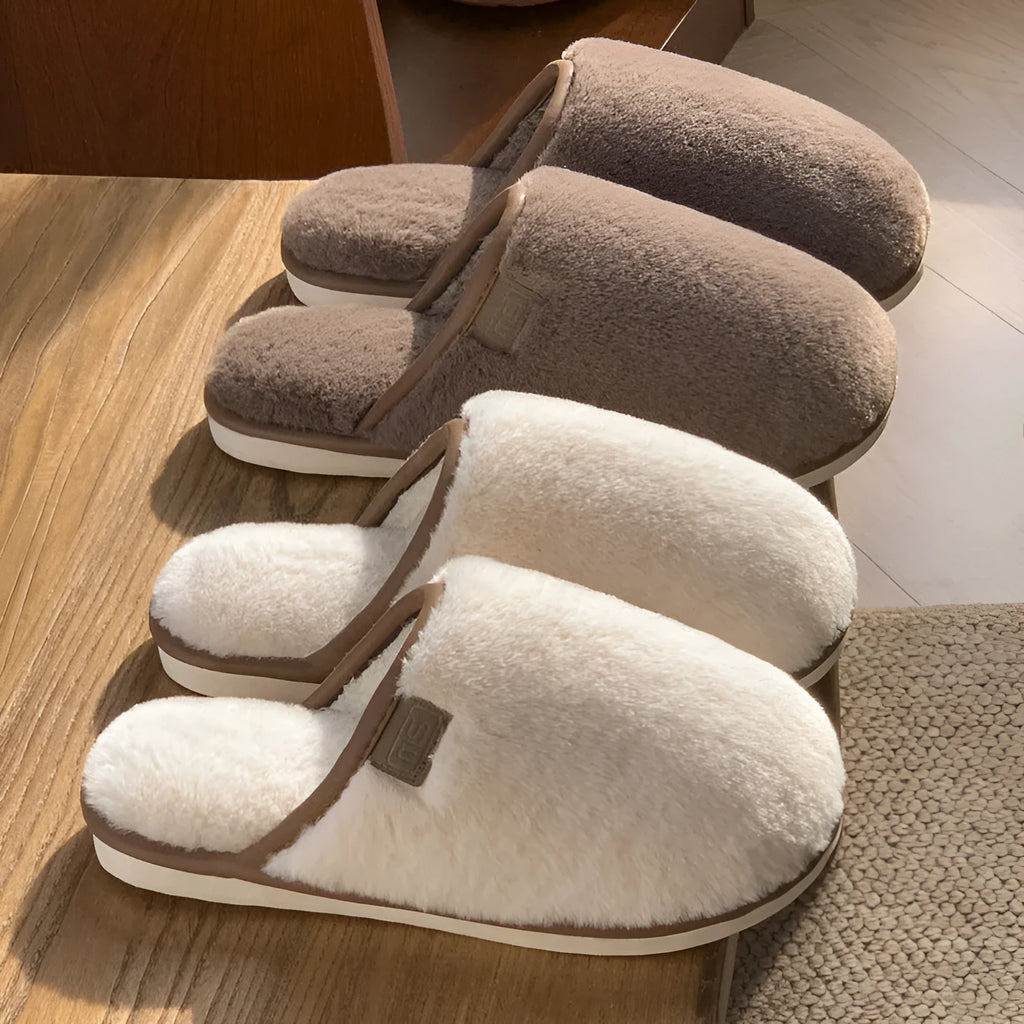 Blue unisex winter plush PVC house slippers with car stitching and a non-slip sole.
