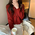 Women's long-sleeved acrylic cardigan coat in multiple colours with regular sleeves.