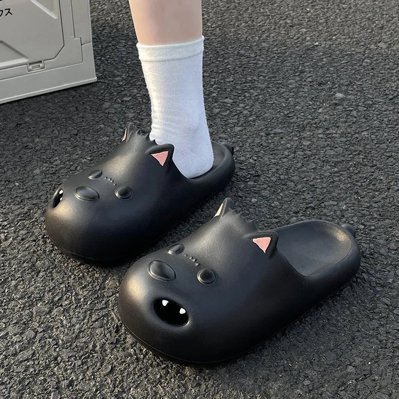Women's black and white EVA puppy slippers with toe cap sandal design on a white background.