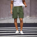 Men's loose fit workwear shorts in fluorescent green with straight leg cut and fifth pants length