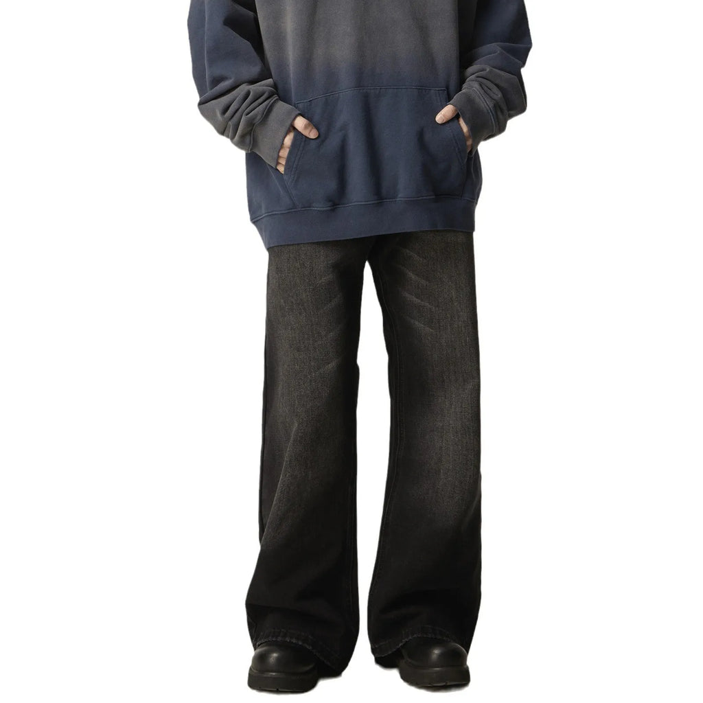 Black loose-fit straight-leg retro jeans with zipper fly on a plain background.