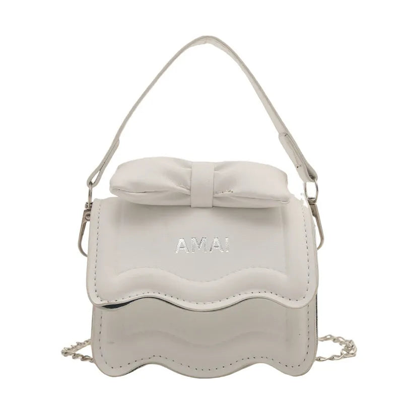 Mini crossbody bag in PU leather with adjustable strap, shown in multiple colour options