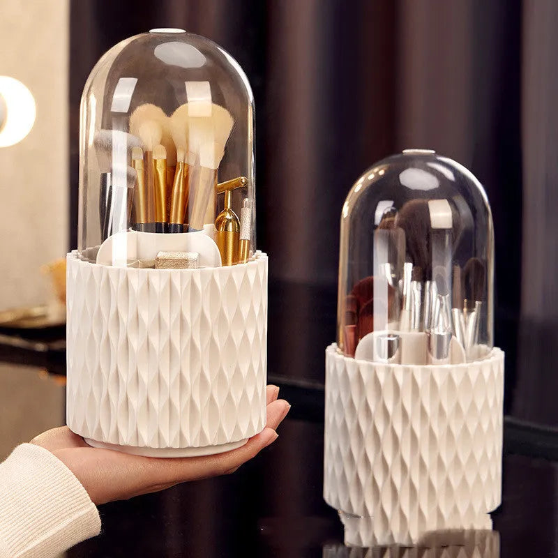White rotating acrylic makeup brush storage box with transparent dust cover on desktop