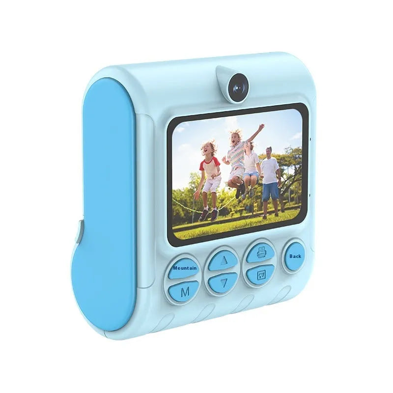 Children's instant thermal printing camera in pink with dual lenses, including lanyard and charging cable on white background