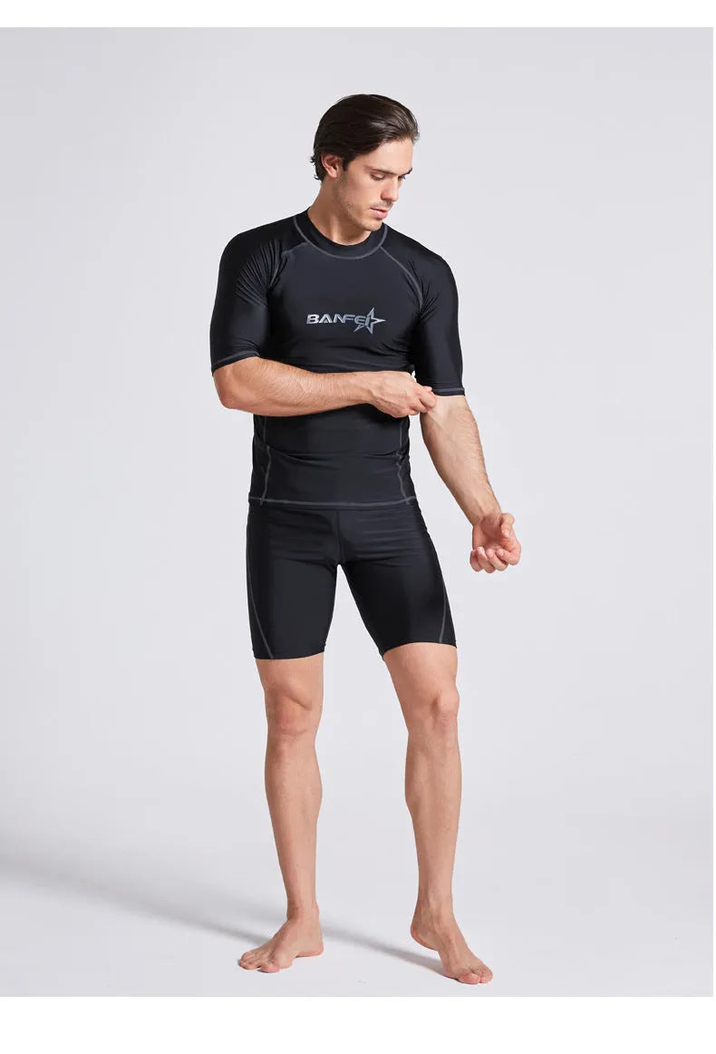 Men's quick-dry half sleeve swimsuit suit for snorkelling, showing separate nylon top and pants.