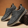 Men's black genuine leather lace-up casual shoes with round toe and stitched sole