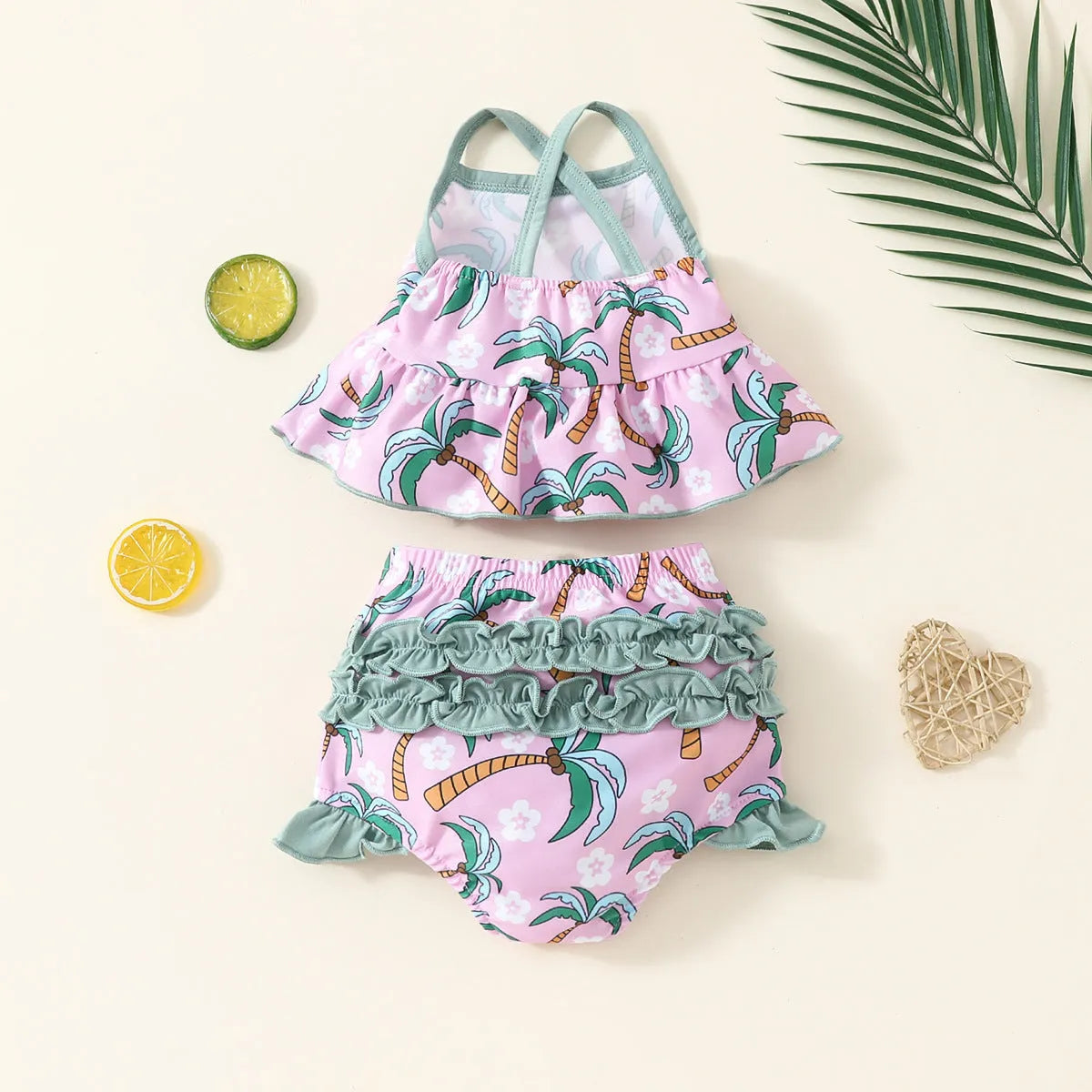 White two-piece baby girl swimsuit set with shirt and shorts for summer beach wear