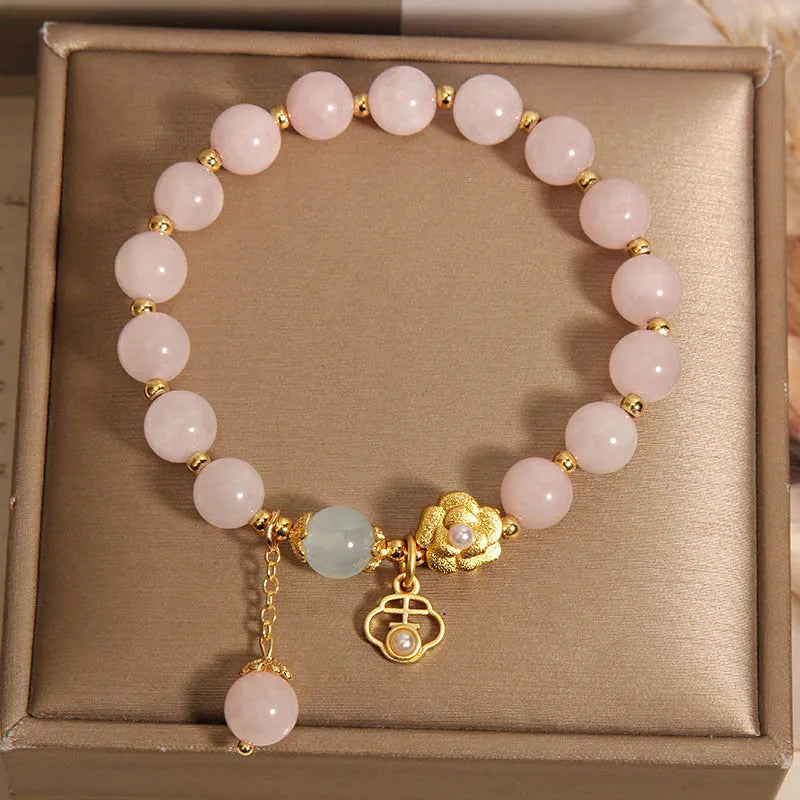 Women's pink crystal flower bracelet with floral pattern design and clasp closure